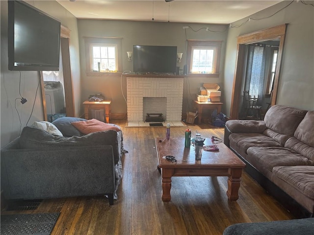 257 Euclid Ave, Sharon, PA 16146 - living area featuring hardwood / wood-style floors, plenty of natural light, a brick fireplace, and washer / dryer