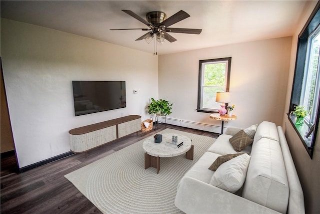 721 Grant Ave, West Mifflin, PA 15122 - living area featuring a baseboard radiator, wood finished floors, baseboards, and a ceiling fan