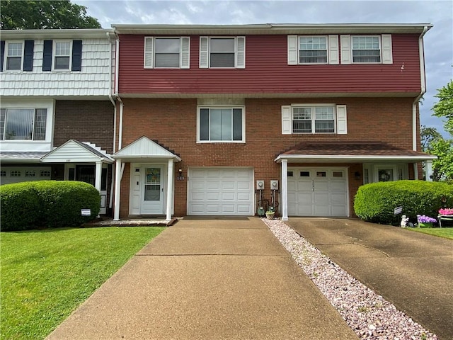 109 Parkside Dr, West Mifflin, PA 15122 - view of front of home with asphalt driveway, an attached garage, a front lawn, and brick siding