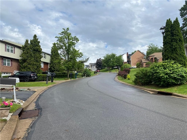 109 Parkside Dr, West Mifflin, PA 15122 - view of asphalt road with a residential view, curbs, and street lights