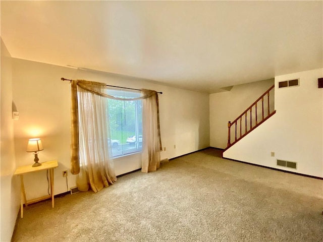 109 Parkside Dr, West Mifflin, PA 15122 - carpeted empty room featuring stairway and baseboards
