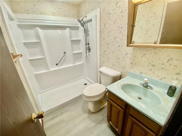 109 Parkside Dr, West Mifflin, PA 15122 - bathroom with wallpapered walls, a stall shower, vanity, and toilet
