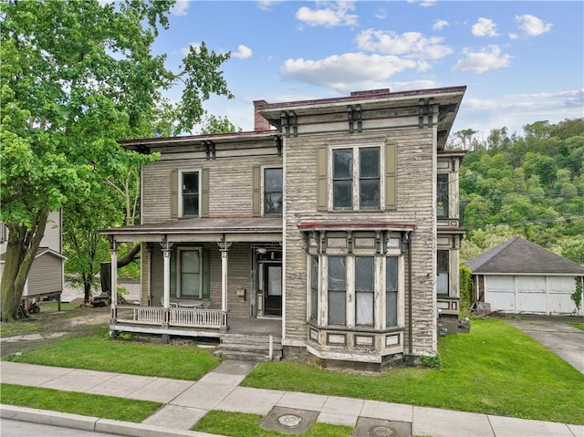 1324 Third Ave, New Brighton, PA 15066 - italianate house with covered porch, a front lawn, and a detached garage