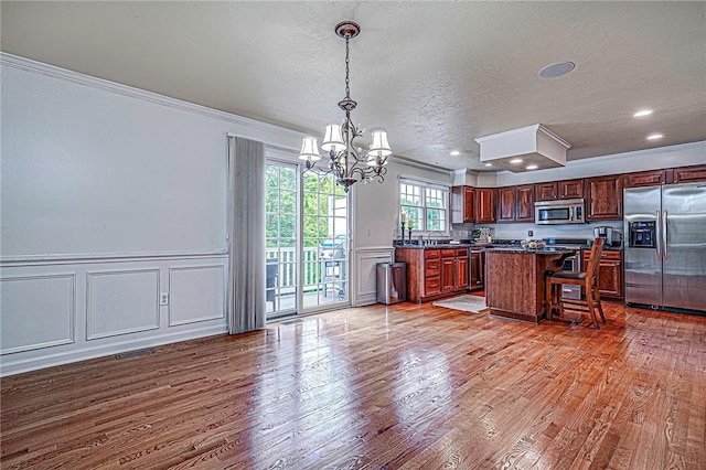 250 Overlook Ct, Robinson Twp Nwa, PA 15108 - kitchen featuring stainless steel appliances, a chandelier, ornamental molding, wood finished floors, and dark countertops