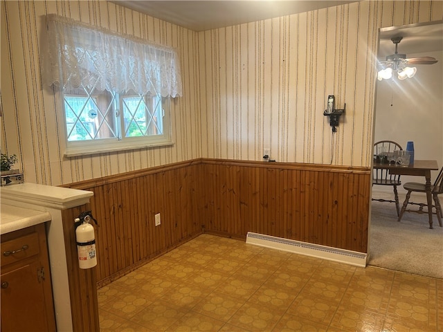 127 Opal Ct, Natrona Hts/Harrison Twp, PA 15065 - unfurnished dining area with wallpapered walls, wainscoting, ceiling fan, and light floors