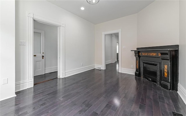 170 Home St, Lawrenceville, PA 15201 - unfurnished living room with dark wood-style flooring, a glass covered fireplace, baseboards, and recessed lighting