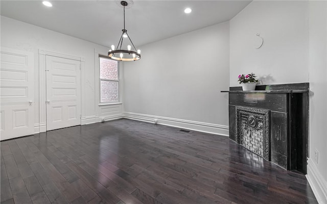 170 Home St, Lawrenceville, PA 15201 - unfurnished dining area with a chandelier, a fireplace, dark wood-type flooring, baseboards, and recessed lighting