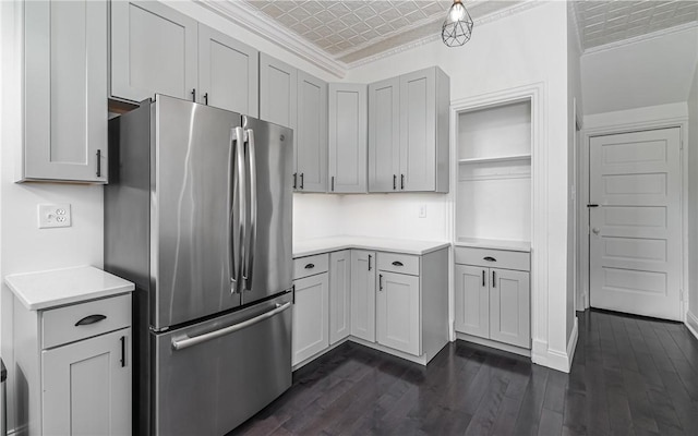 170 Home St, Lawrenceville, PA 15201 - kitchen featuring freestanding refrigerator, crown molding, light countertops, and dark wood-style floors