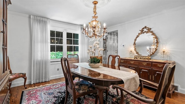 817 Wainwright Dr, Mt Lebanon, PA 15228 - dining space with a chandelier, wood finished floors, baseboards, and crown molding