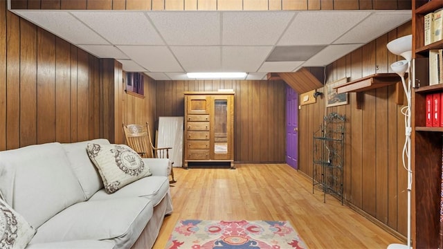 817 Wainwright Dr, Mt Lebanon, PA 15228 - living area featuring a paneled ceiling, light wood-type flooring, and wood walls