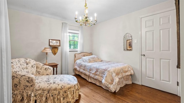 817 Wainwright Dr, Mt Lebanon, PA 15228 - bedroom featuring a chandelier, wood finished floors, and baseboards