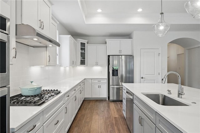 2019 Aiken Ct, Robinson Twp Nwa, PA 15136 - kitchen with stainless steel appliances, under cabinet range hood, a sink, arched walkways, and ornamental molding