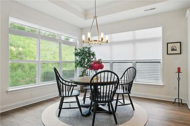 2019 Aiken Ct, Robinson Twp Nwa, PA 15136 - dining space with ornamental molding, a chandelier, dark wood-style floors, healthy amount of natural light, and baseboards