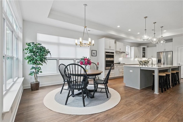 2019 Aiken Ct, Robinson Twp Nwa, PA 15136 - dining room featuring a tray ceiling, dark wood finished floors, a chandelier, recessed lighting, and baseboards