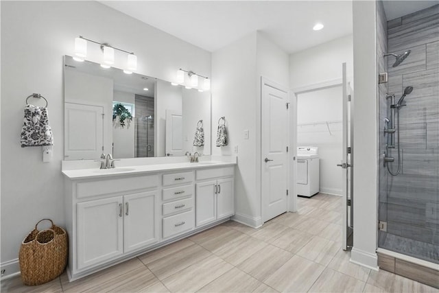 2019 Aiken Ct, Robinson Twp Nwa, PA 15136 - bathroom with washer / clothes dryer, a stall shower, double vanity, and baseboards