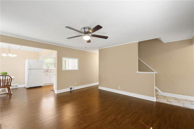 105 Brookwood Rd, Peters Twp, PA 15367 - unfurnished living room with a sink, crown molding, a ceiling fan, dark wood-style flooring, and baseboards