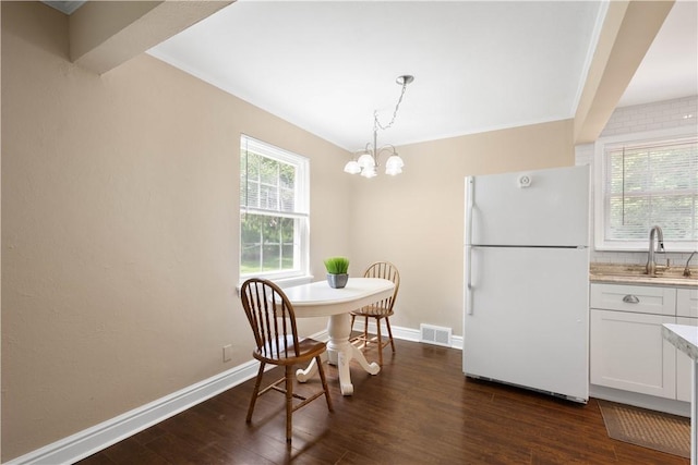 105 Brookwood Rd, Peters Twp, PA 15367 - dining room featuring dark wood-style floors, a chandelier, and baseboards