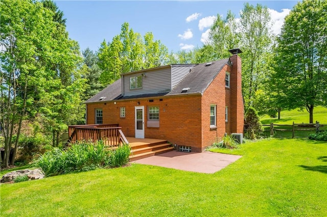 105 Brookwood Rd, Peters Twp, PA 15367 - back of property featuring a deck, a patio area, a chimney, cooling unit, and brick siding
