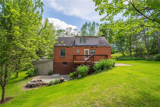 105 Brookwood Rd, Peters Twp, PA 15367 - rear view of property featuring a wooden deck, a lawn, an outdoor fire pit, and a chimney