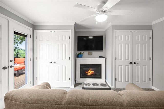 842 Towercrest Dr, Mt Lebanon, PA 15228 - living area featuring baseboards, a glass covered fireplace, a ceiling fan, and crown molding