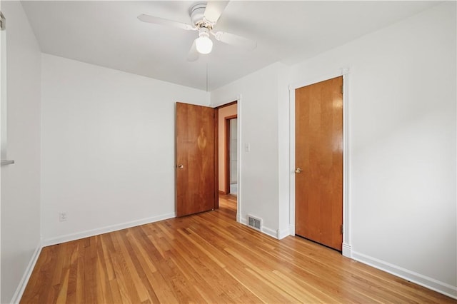 349 State Ave, Beaver, PA 15009 - unfurnished bedroom featuring light wood-style floors, baseboards, and a ceiling fan