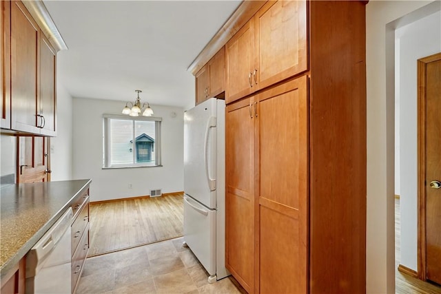 349 State Ave, Beaver, PA 15009 - kitchen with white appliances, a chandelier, baseboards, decorative light fixtures, and light wood-type flooring