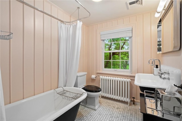 5810 Hampton St, Highland Park, PA 15206 - full bathroom with radiator heating unit, toilet, and a sink