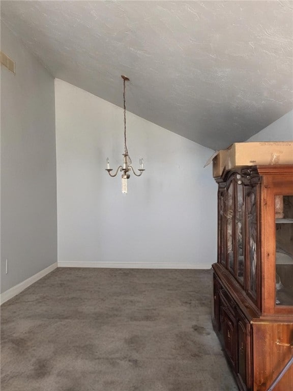 2201 Hunt Club Dr, Hempfield Twp Wml, PA 15601 - unfurnished dining area with lofted ceiling, a chandelier, carpet, and a textured ceiling