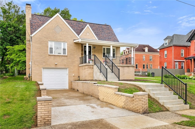 7118 Mcpherson Blvd, Point Breeze, PA 15208 - view of front of property with stairs, an attached garage, concrete driveway, a chimney, and brick siding