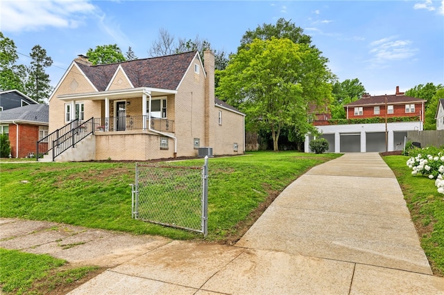 7118 Mcpherson Blvd, Point Breeze, PA 15208 - view of front of home with covered porch, brick siding, a gate, central air condition unit, and a garage