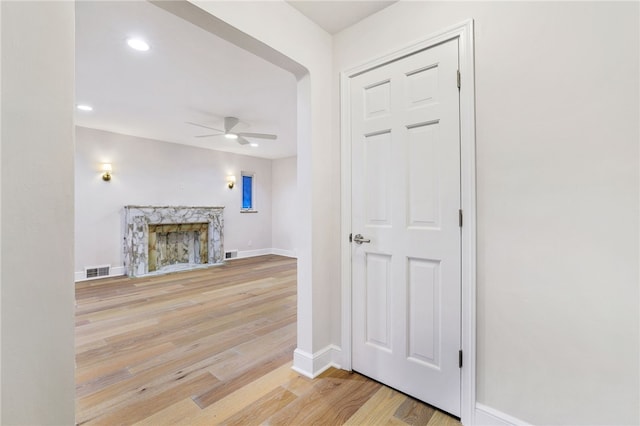 7118 Mcpherson Blvd, Point Breeze, PA 15208 - unfurnished living room with a ceiling fan, light wood-type flooring, a premium fireplace, baseboards, and recessed lighting