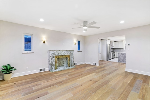 7118 Mcpherson Blvd, Point Breeze, PA 15208 - unfurnished living room with ceiling fan, baseboards, light wood-style floors, recessed lighting, and a high end fireplace