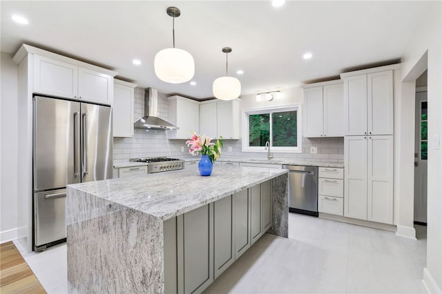 7118 Mcpherson Blvd, Point Breeze, PA 15208 - kitchen featuring stainless steel appliances, wall chimney exhaust hood, a sink, a center island, and backsplash