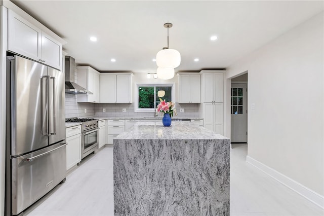 7118 Mcpherson Blvd, Point Breeze, PA 15208 - kitchen featuring high quality appliances, wall chimney range hood, tasteful backsplash, a center island, and recessed lighting