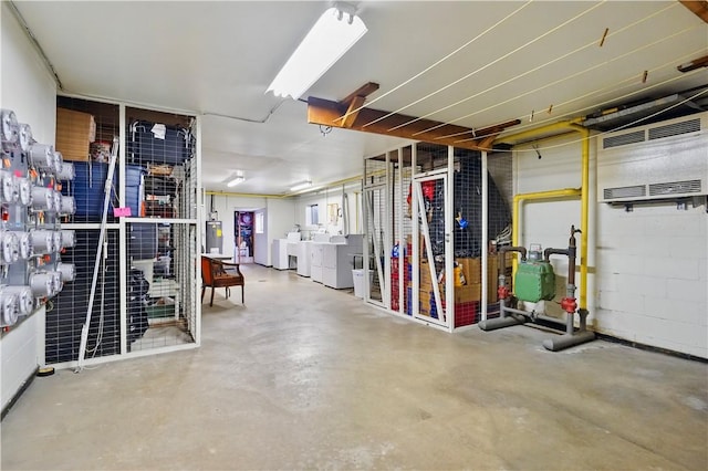 61 Darlington Rd Unit A-12, Patterson Twp, PA 15010 - garage featuring washer and clothes dryer and water heater