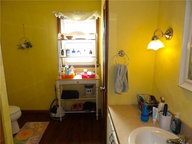 192 Searight Ave, Uniontown, PA 15401 - bathroom with wood finished floors, toilet, and vanity