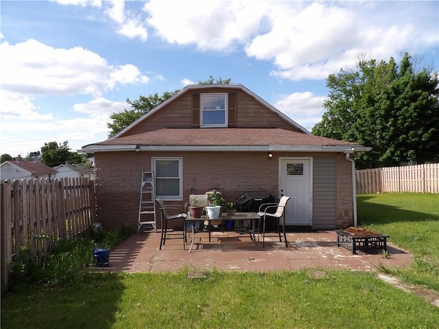 192 Searight Ave, Uniontown, PA 15401 - back of house featuring an outdoor fire pit, a patio, and a shingled roof
