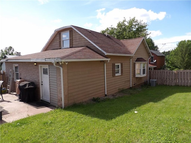 192 Searight Ave, Uniontown, PA 15401 - view of property exterior with a patio area, central AC unit, and a shingled roof