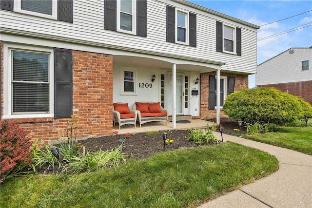 1209 Satellite Cir, Upper St Clair, PA 15241 - view of front of house featuring covered porch and brick siding