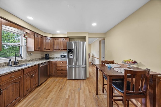 1209 Satellite Cir, Upper St Clair, PA 15241 - kitchen featuring stainless steel appliances, a sink, light wood-style floors, light stone countertops, and recessed lighting
