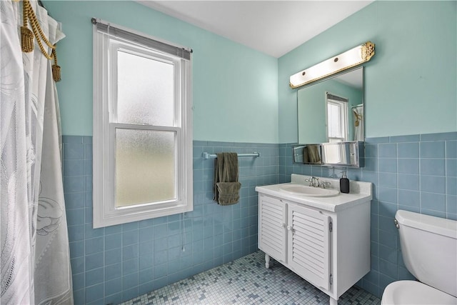 1209 Satellite Cir, Upper St Clair, PA 15241 - bathroom with tile walls, vanity, wainscoting, toilet, and tile patterned flooring