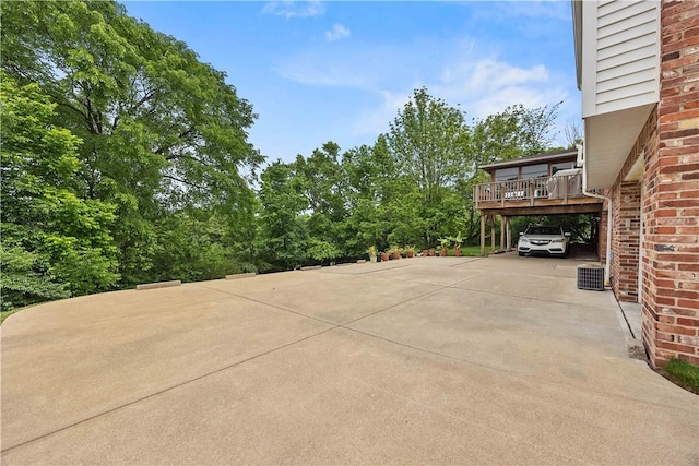 1209 Satellite Cir, Upper St Clair, PA 15241 - view of patio featuring concrete driveway, central AC unit, and a carport