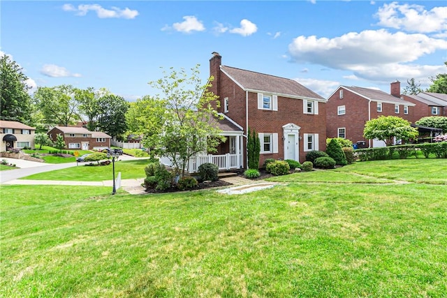 51 Hollow Haven Dr, Baldwin Boro, PA 15236 - view of front of property with a front lawn, a porch, brick siding, and a chimney