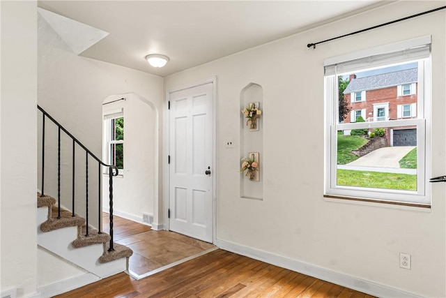 51 Hollow Haven Dr, Baldwin Boro, PA 15236 - foyer with wood finished floors, healthy amount of natural light, arched walkways, and stairs