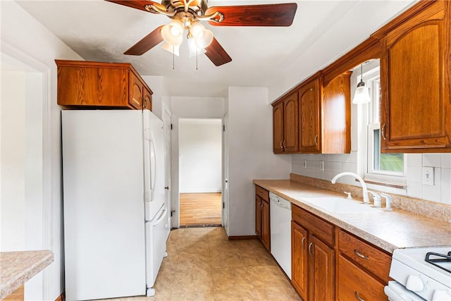 51 Hollow Haven Dr, Baldwin Boro, PA 15236 - kitchen featuring white appliances, a sink, tasteful backsplash, light countertops, and brown cabinets