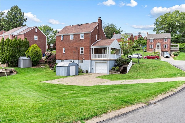 51 Hollow Haven Dr, Baldwin Boro, PA 15236 - rear view of house with stairway, a garage, a chimney, a yard, and brick siding