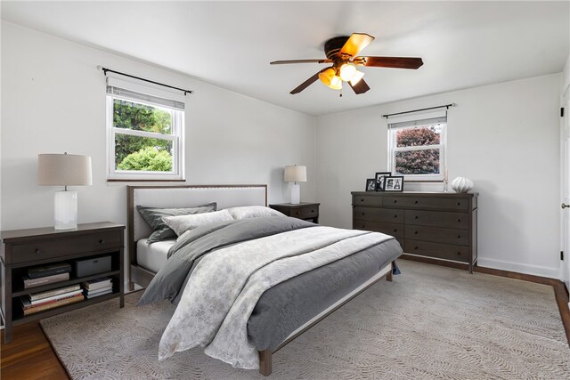 51 Hollow Haven Dr, Baldwin Boro, PA 15236 - bedroom featuring multiple windows, wood finished floors, a ceiling fan, and baseboards