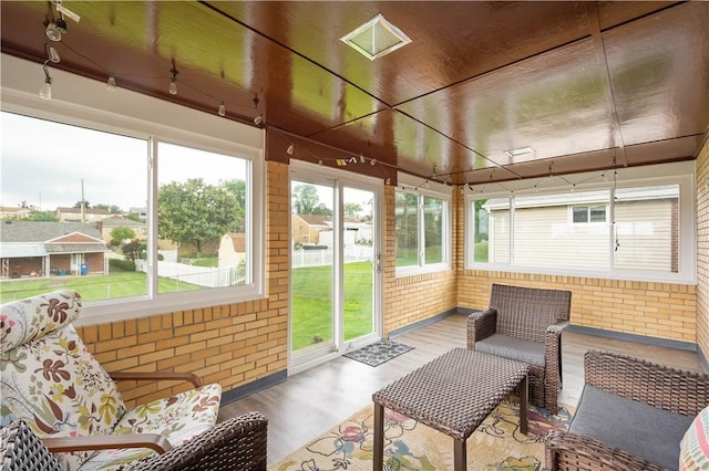 5266 Meadowcrest Rd, Baldwin Boro, PA 15236 - sunroom with wood finished floors and brick wall