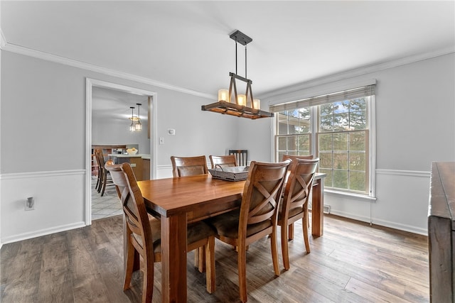 7104 Cresswyck Ct, Marshall, PA 15090 - dining space featuring crown molding, wood finished floors, and baseboards