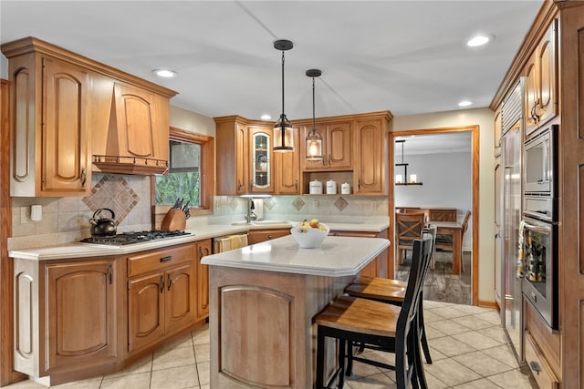 7104 Cresswyck Ct, Marshall, PA 15090 - kitchen featuring stainless steel appliances, light countertops, light tile patterned floors, a center island, and recessed lighting